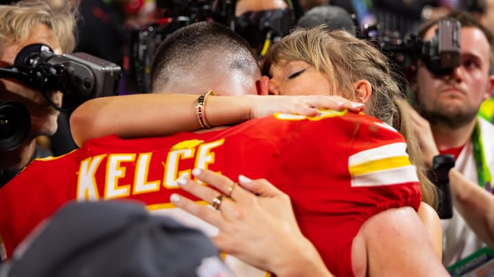 Feb 11, 2024; Paradise, Nevada, USA; Kansas City Chiefs tight end Travis Kelce (87) celebrates with girlfriend Taylor Swift after defeating the San Francisco 49ers in Super Bowl LVIII at Allegiant Stadium. 