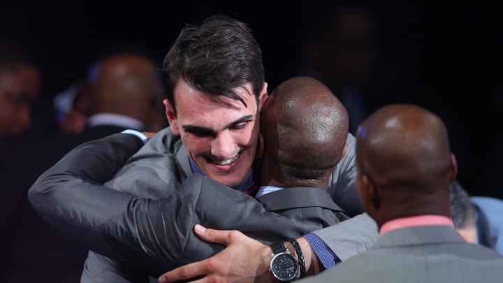 Jun 26, 2014; Brooklyn, NY, USA; Dario Saric (Croatia) gets a hug after being selected as the number twelve overall pick to the Orlando Magic in the 2014 NBA Draft at the Barclays Center. Mandatory Credit: Brad Penner-USA TODAY Sports