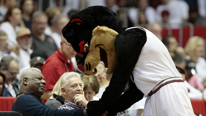 Feb. 20, 2016: The UC Bearcat shakes hands with Bearcats legend Oscar Robertson in the first half of the NCAA basketball game between the Cincinnati Bearcats and the Connecticut Huskies at Fifth Third Arena.