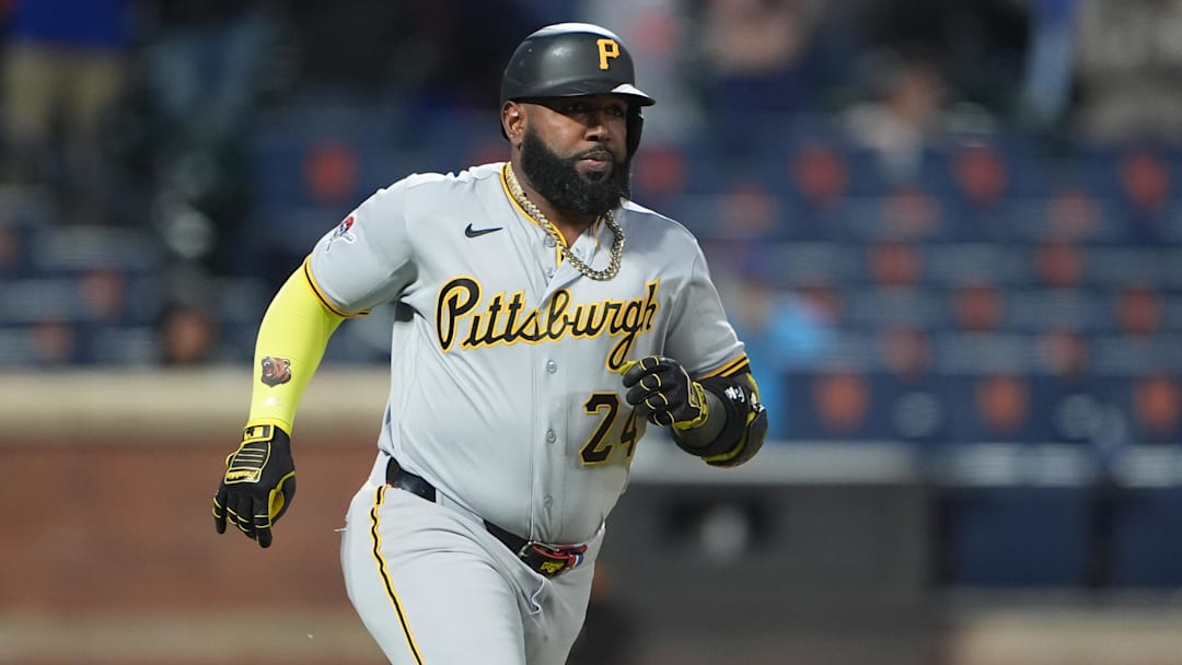 Mar 28, 2026; New York City, New York, USA; Pittsburgh Pirates designated hitter Marcell Ozuna (24) runs out a single against the New York Mets during the eleventh inning at Citi Field. Mandatory Credit: Gregory Fisher-Imagn Images