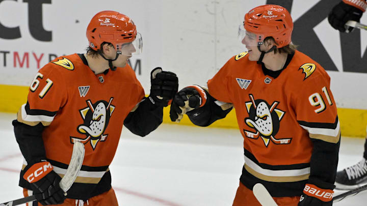 Apr 9, 2025; Anaheim, California, USA;  Anaheim Ducks left wing Cutter Gauthier (61) is congratulated by center Leo Carlsson (91) after a goal during the third period against the Calgary Flames as Honda Center. Mandatory Credit: Jayne Kamin-Oncea-Imagn Images