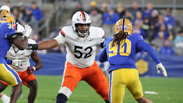Nov 9, 2024; Pittsburgh, Pennsylvania, USA;  Virginia Cavaliers offensive lineman McKale Boley (52) blocks at the line of scrimmage against the Pittsburgh Panthers during the third quarter at Acrisure Stadium. Mandatory Credit: Charles LeClaire-Imagn Images