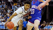 Nicolet's Davion Hannah (25) attempts to get pass Wisconsin Lutheran's Kon Knueppel (33) during the first half of the WIAA Division 2 boys basketball state semifinal game on Friday March 15, 2024 at the Kohl Center in Madison, Wis.