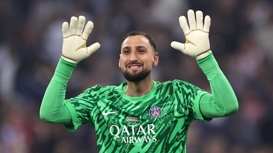 Gianluigi Donnarumma with arms held up.