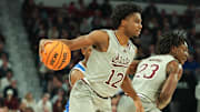 Jan 11, 2025; Starkville, Mississippi, USA; Mississippi State Bulldogs guard Josh Hubbard (12) handles the ball against the Kentucky Wildcats during the second half at Humphrey Coliseum. Mandatory Credit: Wesley Hale-Imagn Images