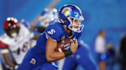 Oct 15, 2021; San Jose, California, USA; San Jose State Spartans quarterback Nick Nash (16) carries the ball during the fourth quarter against the San Diego State Aztecs at CEFCU Stadium. Mandatory Credit: Darren Yamashita-Imagn Images