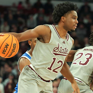 Jan 11, 2025; Starkville, Mississippi, USA; Mississippi State Bulldogs guard Josh Hubbard (12) handles the ball against the Kentucky Wildcats during the second half at Humphrey Coliseum. Mandatory Credit: Wesley Hale-Imagn Images