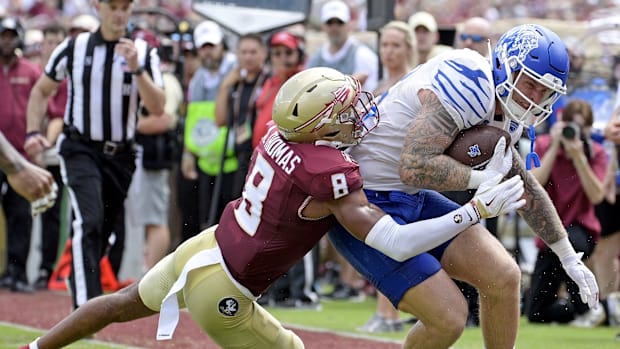 Memphis Tigers tight end Anthony Landphere (82) is tackled by Florida State Seminoles defensive back Azareye'h Thomas