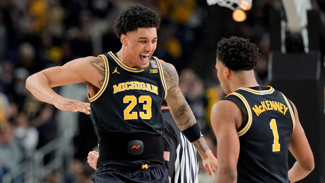 Michigan forward Yaxel Lendeborg (23) celebrates a play with Michigan guard Trey McKenney (1) in the first half of their Final Four game at Lucas Oil Stadium in Indianapolis on Saturday, April 4, 2026.