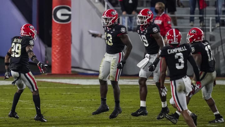 Nov 21, 2020; Athens, Georgia, USA; Georgia Bulldogs defenders react after they tackled Mississippi