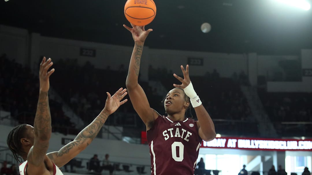 Feb 7, 2026; Starkville, Mississippi, USA; Mississippi State Bulldogs forward Jamarion Davis-Fleming (0) shoots over Arkansas Razorbacks forward Nick Pringle (23) during the second half at Humphrey Coliseum. Mandatory Credit: Petre Thomas-Imagn Images