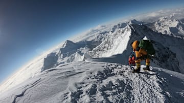 Mountaineers making their way to the summit out Mount Everest.