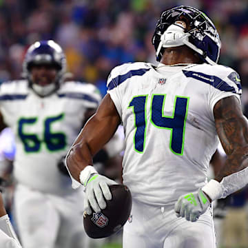 Dec 4, 2022; Inglewood, California, USA; Seattle Seahawks wide receiver DK Metcalf (14) celebrates his touchdown scored against the Los Angeles Rams with quarterback Geno Smith (7) during the second half at SoFi Stadium. Mandatory Credit: Gary A. Vasquez-Imagn Images