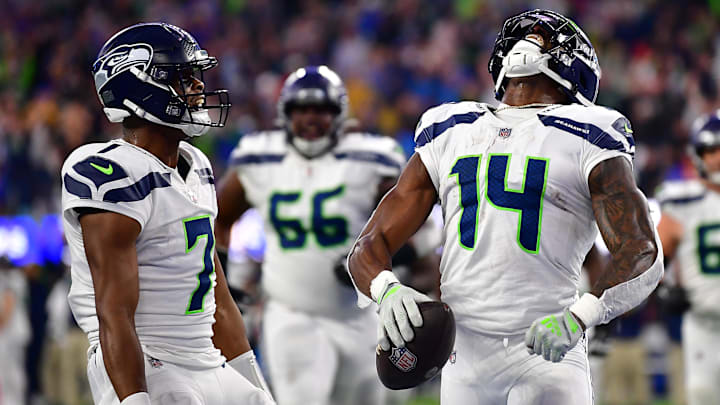 Dec 4, 2022; Inglewood, California, USA; Seattle Seahawks wide receiver DK Metcalf (14) celebrates his touchdown scored against the Los Angeles Rams with quarterback Geno Smith (7) during the second half at SoFi Stadium. Mandatory Credit: Gary A. Vasquez-Imagn Images