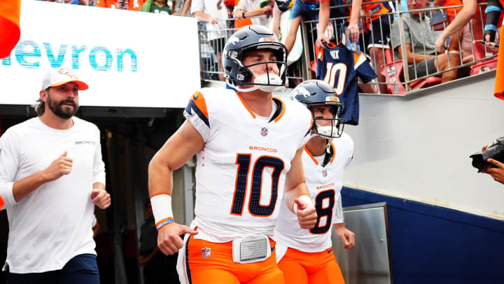 Aug 18, 2024; Denver, Colorado, USA; Denver Broncos quarterback Bo Nix (10) and quarterback Jarrett Stidham (8) before the preseason game against the Green Bay Packers at Empower Field at Mile High. Mandatory Credit: Ron Chenoy-USA TODAY Sports