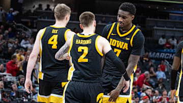 Mar 12, 2025; Indianapolis, IN, USA; Iowa Hawkeyes guard Brock Harding (2) celebrates with teammates after hitting the game winning 3 point shot in the second half against the Ohio State Buckeyes  at Gainbridge Fieldhouse. Mandatory Credit: Trevor Ruszkowski-Imagn Images