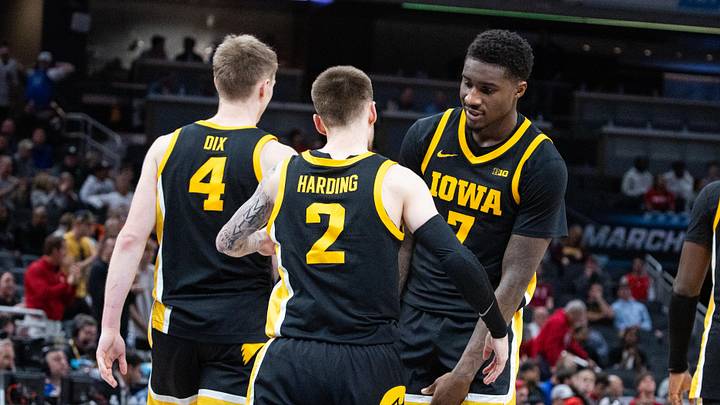 Mar 12, 2025; Indianapolis, IN, USA; Iowa Hawkeyes guard Brock Harding (2) celebrates with teammates after hitting the game winning 3 point shot in the second half against the Ohio State Buckeyes  at Gainbridge Fieldhouse. Mandatory Credit: Trevor Ruszkowski-Imagn Images