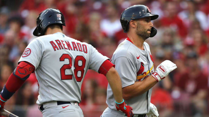 Jul 23, 2021; Cincinnati, Ohio, USA;St. Louis Cardinals first baseman Paul Goldschmidt (46) reacts with third baseman Nolan Arenado (28) after hitting a solo home run against the Cincinnati Reds in the first inning at Great American Ball Park. Mandatory Credit: David Kohl-USA TODAY Sports