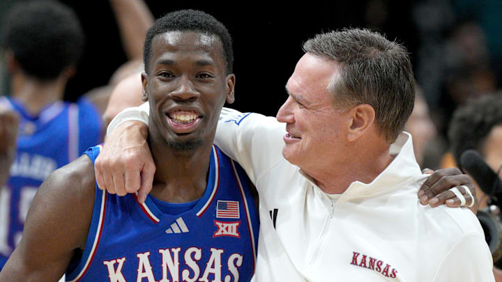Kansas basketball guard Melvin Council Jr and head coach Bill Self