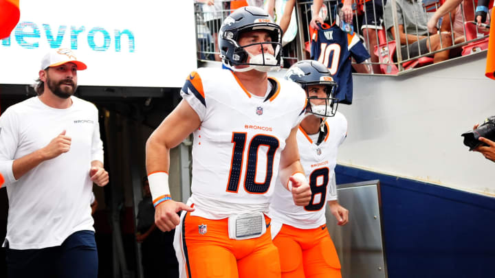 Aug 18, 2024; Denver, Colorado, USA; Denver Broncos quarterback Bo Nix (10) and quarterback Jarrett Stidham (8) before the preseason game against the Green Bay Packers at Empower Field at Mile High. Mandatory Credit: Ron Chenoy-USA TODAY Sports