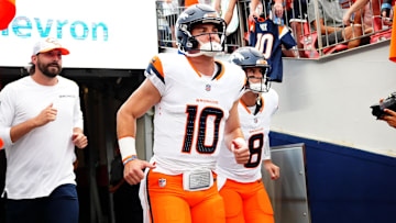 Aug 18, 2024; Denver, Colorado, USA; Denver Broncos quarterback Bo Nix (10) and quarterback Jarrett Stidham (8) before the preseason game against the Green Bay Packers at Empower Field at Mile High. Mandatory Credit: Ron Chenoy-Imagn Images