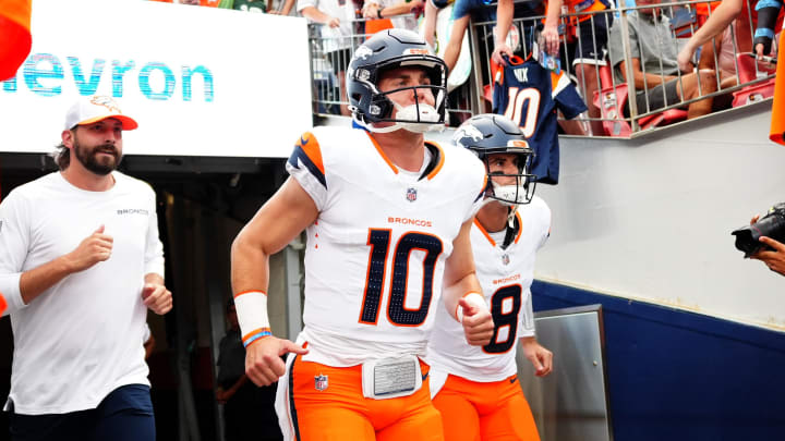 Aug 18, 2024; Denver, Colorado, USA; Denver Broncos quarterback Bo Nix (10) and quarterback Jarrett Stidham (8) before the preseason game against the Green Bay Packers at Empower Field at Mile High. Mandatory Credit: Ron Chenoy-USA TODAY Sports