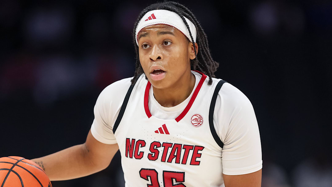 Nov 9, 2025; Charlotte, North Carolina, USA; NC State Wolfpack guard Zoe Brooks (35) dribbles the ball against the Southern California Trojans during the first quarter of the Ally Tipoff game at Spectrum Center. Mandatory Credit: Cory Knowlton-Imagn Images