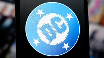 In this photo illustration, the DC Comics logo is seen...