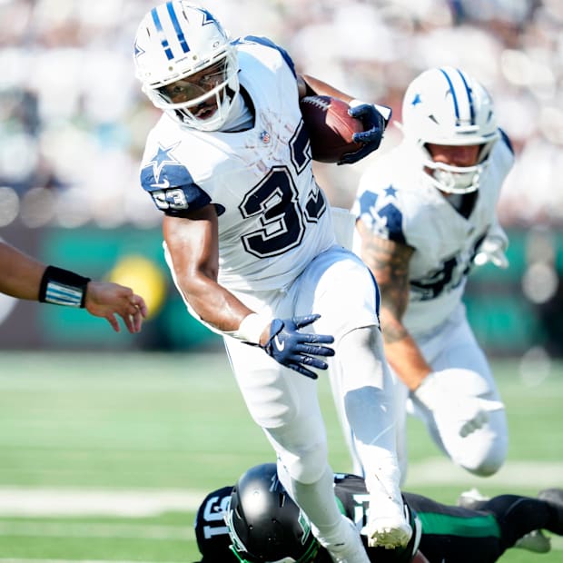 Dallas Cowboys running back Javonte Williams moves the ball to within a few yards of the end zone.
