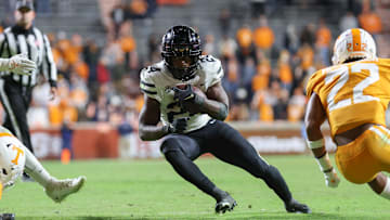 Nov 27, 2021; Knoxville, Tennessee, USA; Vanderbilt Commodores running back Rocko Griffin (24) runs the ball against the Tennessee Volunteers during the second half at Neyland Stadium. Mandatory Credit: Randy Sartin-Imagn Images