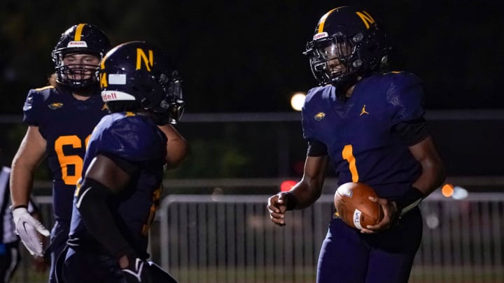 Naples Golden Eagles quarterback Alijah Molina (1) celebrates after scoring a touchdown during the fourth quarter of the season opener against the Sarasota Riverview Rams at Staver Field in Naples on Friday, Aug. 23, 2024.