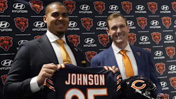 Chicago Bears new head coach Ben Johnson (right) with general manager Ryan Poles pose for photos after a press conference introducing him at PNC Center.