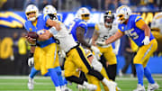 Nov 9, 2025; Inglewood, California, USA; Pittsburgh Steelers linebacker Alex Highsmith (56) sacks Los Angeles Chargers quarterback Justin Herbert (10) during the third quarter of the game at SoFi Stadium. Mandatory Credit: Gary A. Vasquez-Imagn Images