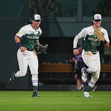 Aug 31, 2024; Denver, Colorado, USA; Colorado Rockies outfielder Nolan Jones (22) and outfielder Brenton Doyle (9) and outfielder Jordan Beck (27) celebrate defeating the Baltimore Orioles in the ninth inning at Coors Field.