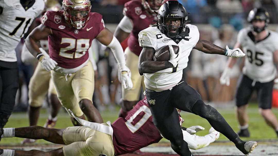 Wake Forest Demon Deacons running back Demond Claiborne (1) runs the ball during the first quarter.