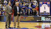 Mar 5, 2016; Lawrence, KS, USA; Kansas Jayhawks broadcaster Bob Davis is recognized by Athletic Director Sheahon Zenger during halftime of the game against the Iowa State Cyclones at Allen Fieldhouse. Davis is retiring. Kansas won the game 85-78. Mandatory Credit: John Rieger-Imagn Images