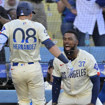 Jul 20, 2024; Los Angeles, California, USA;  Los Angeles Dodgers third baseman Enrique Hernandez (8) celebrates with right fielder Teoscar Hernandez (37) after hitting a two-run home run in the seventh inning against the Boston Red Sox at Dodger Stadium. Mandatory Credit: Jayne Kamin-Oncea-Imagn Images