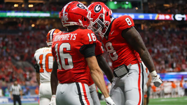 Georgia Bulldogs wide receiver London Humphreys celebrates after a touchdown with wide receiver Colbie Young.