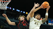 Nov 24, 2025; Las Vegas, Nevada, USA; Michigan Wolverines forward Yaxel Lendeborg (23) reaches for a rebound against San Diego State Aztecs forward Miles Heide (40).