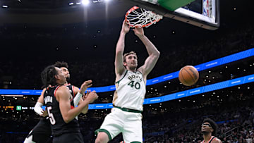 Apr 7, 2024; Boston, Massachusetts, USA; Boston Celtics center Luke Kornet (40) dunks the ball against the Portland Trail Blazers during the second half at TD Garden. Mandatory Credit: Eric Canha-Imagn Images