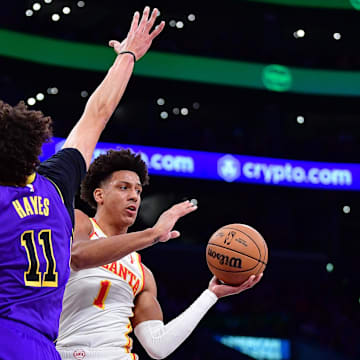 Jan 3, 2025; Los Angeles, California, USA; Atlanta Hawks forward Jalen Johnson (1) moves the ball against Los Angeles Lakers center Jaxson Hayes (11) during the first half at Crypto.com Arena. Mandatory Credit: Gary A. Vasquez-Imagn Images