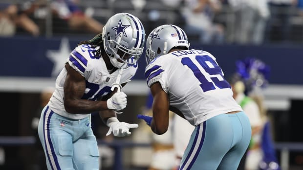 Dallas Cowboys wide receiver Amari Cooper (19) celebrates with Cowboys wide receiver CeeDee Lamb (88) after scoring a touchdo