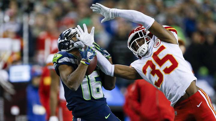 Dec 23, 2018; Seattle, WA, USA; Seattle Seahawks wide receiver Tyler Lockett (16) catches a 45-yard pass against Kansas City Chiefs cornerback Charvarius Ward (35) during the fourth quarter at CenturyLink Field. Mandatory Credit: Joe Nicholson-Imagn Images