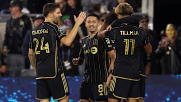 LAFC midfielder Marco Delgado (8) celebrates with teammates after scoring a goal against the Colorado Rapids during the second half of Concacaf Champions Cup Round 