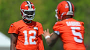 Cleveland Browns quarterback Shedeur Sanders (12) watches quarterback Dillon Gabriel (5) during day two of NFL rookie minicamp at the Cleveland Browns training facility on Saturday, May 10, 2025, in Berea, Ohio.