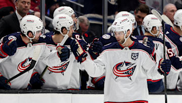 Blue Jackets center Adam Fantilli celebrates a goal with the bench.