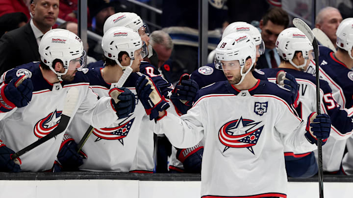 Blue Jackets center Adam Fantilli celebrates a goal with the bench.