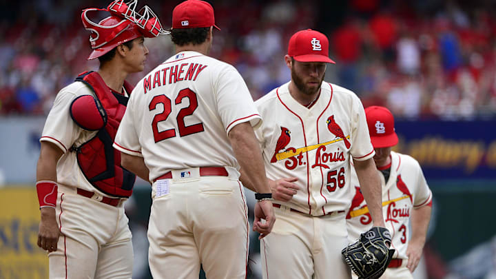 May 19, 2018; St. Louis, MO, USA; St. Louis Cardinals relief pitcher Greg Holland (56) is removed from the game by manager Mike Matheny (22) during the eighth inning against the Philadelphia Phillies at Busch Stadium. Mandatory Credit: Jeff Curry-Imagn Images