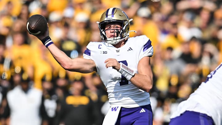 Oct 12, 2024; Iowa City, Iowa, USA; Washington Huskies quarterback Will Rogers (7) throws a pass against the Iowa Hawkeyes during the second quarter at Kinnick Stadium. Mandatory Credit: Jeffrey Becker-Imagn Images