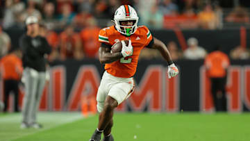 Oct 17, 2025; Miami Gardens, Florida, USA; Miami Hurricanes running back Jordan Lyle (2) carries the football against the Louisville Cardinals during the fourth quarter at Hard Rock Stadium. Mandatory Credit: Sam Navarro-Imagn Images